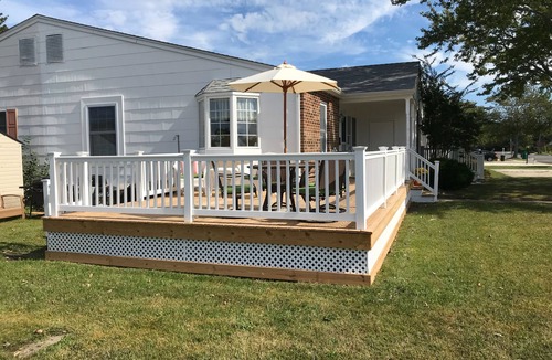 Village Green House | Beautiful corner property with cozy beach vibe.