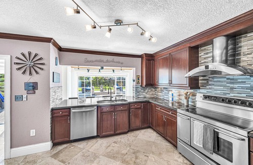 Tamiami House | Spacious Tropical Pool Home Miami. 4/3. Sleeps 13. Large Garden/Backyard.