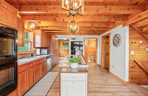 Mattawana Cabin | The perfect family retreat, hot tub, fire pit, playhouse for the kids with a zip line! Plenty of fun for the young and old alike! All while enjoying the majestic views of Juniata County.