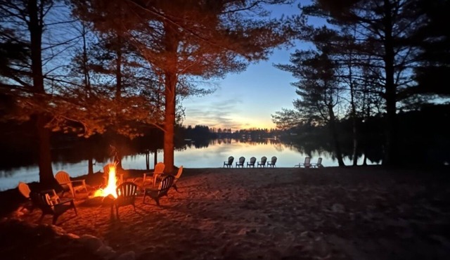 1/2 acre, 450 feet of lake frontage and a sandy beach with sunsets!