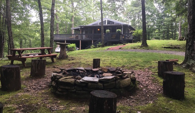 5 acres 4 bedroom cabin close to everything with fire pit, swimming fishing lake