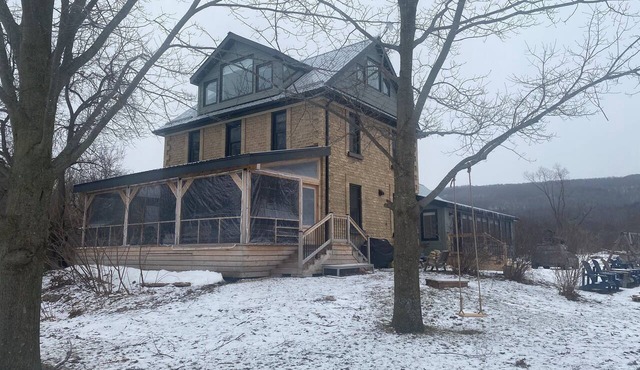Beautifully restored Farmhouse on 64 acres+