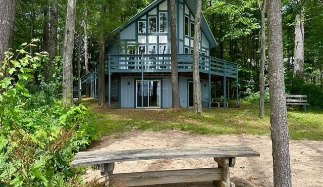 Cozy beachfront cottage in the woods with walkout basement and wrap-around porch