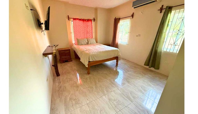 Euphoria suite is a two bedroom, one bathroom unit with a private kitchen, living room, and laundry room. Perfect for groups or two traveling together seeking extra space, privacy, and elegant Caribbean comfort!