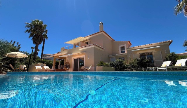 Large private detached three bedroom villa with heated infinity swimming pool