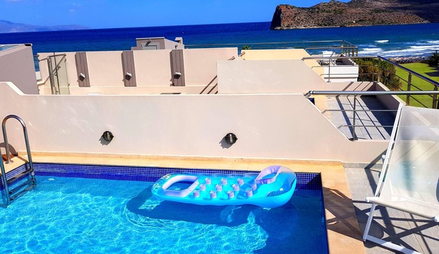 Luxurious 5-bedroom beachfront villa with a private rooftop pool and sea view
