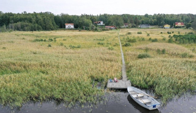 Seaside plot with private jetty, rowing boat & sunset