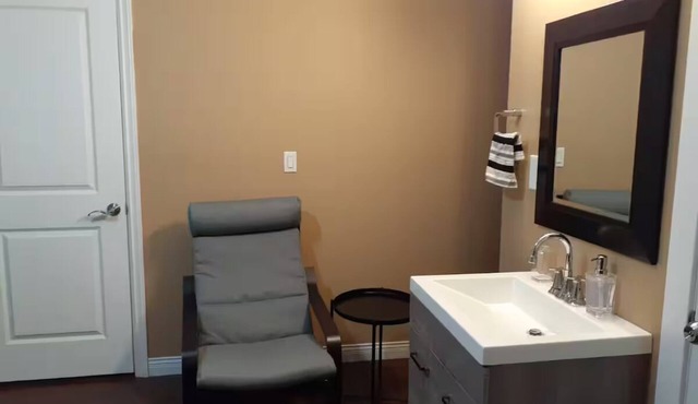 Small, renovated, private 1 bedroom bathroom in front of bus stop to downtown.