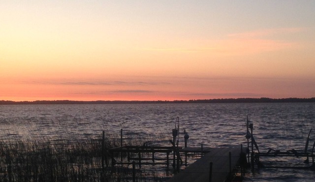 Spectacular sunrise glistening off the lake from this quiet lakeside retreat